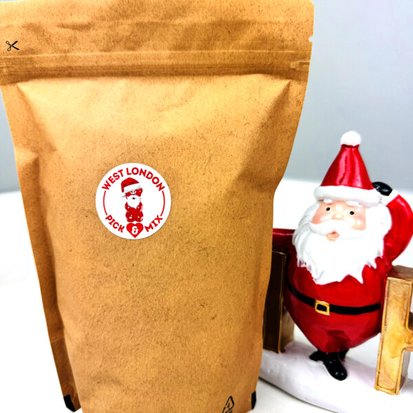 Brown pouch filled with pick & mix sweets next t a santa